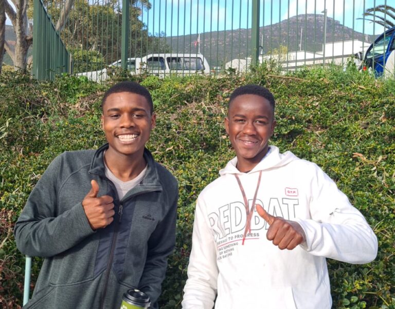 Vogen and Sibongile giving a thumbs up when they received their Visas to travel to the USA to participate in the 4th Annual Khayamandi Golf Tournament! 